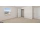 Bright carpeted bedroom with a closet and window allowing natural light at 1628 Palladian Dr, Lithonia, GA 30058