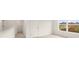Bright bedroom with neutral carpet, white walls and a large window allowing ample natural light at 1628 Palladian Dr, Lithonia, GA 30058