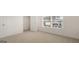 Bright bedroom features neutral carpet, closet, and window with natural light at 1628 Palladian Dr, Lithonia, GA 30058