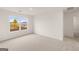 Bright bedroom with neutral carpet, white walls and a large window allowing ample natural light at 1628 Palladian Dr, Lithonia, GA 30058