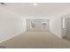 Bright, open bedroom with carpet flooring, natural light, and a clean, minimalist design at 1628 Palladian Dr, Lithonia, GA 30058