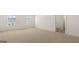 Spacious carpeted bedroom featuring natural light from two windows and a neutral color palette at 1628 Palladian Dr, Lithonia, GA 30058