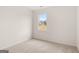 Bedroom with neutral walls and carpet with a window overlooking the lawn at 1628 Palladian Dr, Lithonia, GA 30058