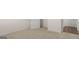 Cozy, carpeted bedroom featuring a bright interior, with a view to an adjoining area with wood floors at 1628 Palladian Dr, Lithonia, GA 30058