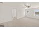 Large, bright bedroom with carpet and two windows overlooking the neighborhood at 1628 Palladian Dr, Lithonia, GA 30058