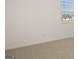 Bright, airy bedroom showcasing neutral tones, carpeted floors, and a sunlit window at 1628 Palladian Dr, Lithonia, GA 30058