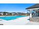 Sparkling community pool with stone accents, grilling area, and inviting lounge area for residents at 1628 Palladian Dr, Lithonia, GA 30058