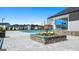 Community pool area with stone accents, a covered grilling station, and inviting landscaping at 1628 Palladian Dr, Lithonia, GA 30058