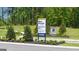Community sign for Champion's Run with builder information at 1628 Palladian Dr, Lithonia, GA 30058