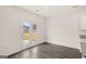 Bright dining area has wood-look floors and doors leading to the backyard at 1628 Palladian Dr, Lithonia, GA 30058