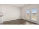 Dining area with wood-look flooring and a door leading to the backyard and patio at 1628 Palladian Dr, Lithonia, GA 30058