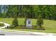 Community entrance monument with stone accent and manicured landscaping at 1628 Palladian Dr, Lithonia, GA 30058