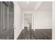 Inviting entryway features wood-look flooring and access to other rooms in the home at 1628 Palladian Dr, Lithonia, GA 30058