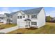 Inviting two-story home with well-maintained landscaping, a two-car garage, and a cozy front porch at 1628 Palladian Dr, Lithonia, GA 30058