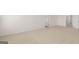 Hallway featuring modern doors, neutral carpet, and bright, open floor plan at 1628 Palladian Dr, Lithonia, GA 30058