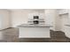 Modern kitchen featuring granite countertops, stainless steel appliances, and center island with sink at 1628 Palladian Dr, Lithonia, GA 30058