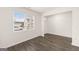Bright living room has wood-look floors and a large window, providing ample light at 1628 Palladian Dr, Lithonia, GA 30058