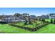 Community playground with slides, climbing structure and manicured lawn near community pool and pavilion at 1628 Palladian Dr, Lithonia, GA 30058