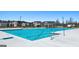 Community pool with clear blue water and lounge area for residents of this community at 1628 Palladian Dr, Lithonia, GA 30058
