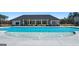 Community pool with clear blue water, fountain feature, and lounge area for residents at 1628 Palladian Dr, Lithonia, GA 30058