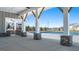 Community poolside pavilion boasts a stone counter, outdoor bar, grill, and ceiling fans at 1628 Palladian Dr, Lithonia, GA 30058