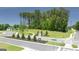 Street view showing new home community entry and surrounding trees at 1628 Palladian Dr, Lithonia, GA 30058