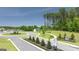 Street view showing the Champion's Run neighborhood entry with signage and landscaping at 1628 Palladian Dr, Lithonia, GA 30058
