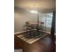 Dining room features a modern chandelier and natural light at 3775 Highway 16 E, Sharpsburg, GA 30277