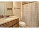 Bathroom with modern vanity, large mirror, and patterned shower curtain at 312 Relative Trl, Mcdonough, GA 30253