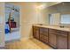 Bathroom with a double vanity, granite countertop, and views of the adjacent main bedroom at 312 Relative Trl, Mcdonough, GA 30253