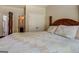 Bedroom featuring a unique wooden bedframe and ensuite bathroom at 312 Relative Trl, Mcdonough, GA 30253