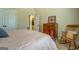 View of bedroom with ensuite bathroom, rocking chair, and large closet at 312 Relative Trl, Mcdonough, GA 30253