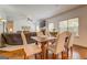 Open-concept dining area offers hardwood floors, natural light, and a view to the living space at 312 Relative Trl, Mcdonough, GA 30253