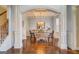 Sunlit dining room features a charming table with bench seating and coffered ceiling at 312 Relative Trl, Mcdonough, GA 30253