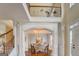 Open-concept dining room view from above with large windows and elegant lighting at 312 Relative Trl, Mcdonough, GA 30253
