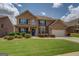 Lovely brick two-story home featuring manicured landscaping and an attached two-car garage at 312 Relative Trl, Mcdonough, GA 30253