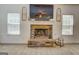 Living room fireplace has stone surround, mantel, and decorative accents at 312 Relative Trl, Mcdonough, GA 30253