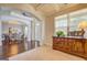 Inviting foyer boasts hardwood floors, a stylish console table, and open access to the dining area at 312 Relative Trl, Mcdonough, GA 30253