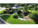 Aerial view of the community gazebo surrounded by lush landscaping and a serene water feature at 312 Relative Trl, Mcdonough, GA 30253
