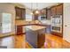 Modern kitchen featuring granite counters, stainless appliances, and ample cabinet space at 312 Relative Trl, Mcdonough, GA 30253