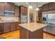 Well-equipped kitchen features stainless steel appliances, granite counters, and custom cabinets at 312 Relative Trl, Mcdonough, GA 30253