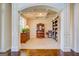 Cozy living room featuring plush carpet, classic furnishings, and decorative shelving at 312 Relative Trl, Mcdonough, GA 30253