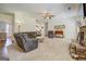 Comfortable living space features a stone fireplace, neutral colors, and wood accents at 312 Relative Trl, Mcdonough, GA 30253