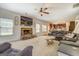 Open-concept living room features a fireplace and flows into the adjacent kitchen at 312 Relative Trl, Mcdonough, GA 30253