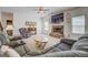 Spacious living room includes comfortable seating, a fireplace, and ample natural light at 312 Relative Trl, Mcdonough, GA 30253