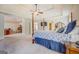 Spacious main bedroom featuring carpeted floors and a doorway to an adjacent room at 312 Relative Trl, Mcdonough, GA 30253