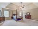 Bright primary bedroom with large windows and a four-poster bed at 312 Relative Trl, Mcdonough, GA 30253