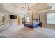 Oversized primary bedroom with tray ceilings and neutral walls and decor at 312 Relative Trl, Mcdonough, GA 30253