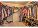 This walk-in closet offers ample storage space with shelves, rods, and drawers at 312 Relative Trl, Mcdonough, GA 30253