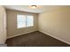 Inviting bedroom featuring new carpeting, one window providing natural light, and neutral wall paint at 2015 Boulderview Se Dr, Atlanta, GA 30316